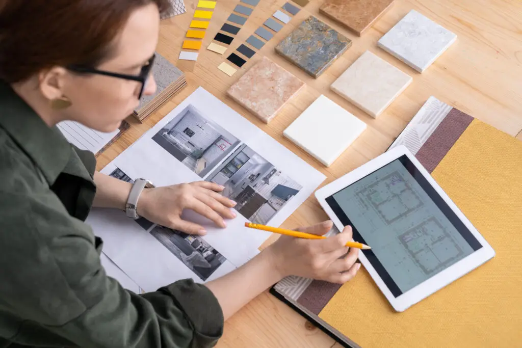 Desginer look at a room layout on an ipad.