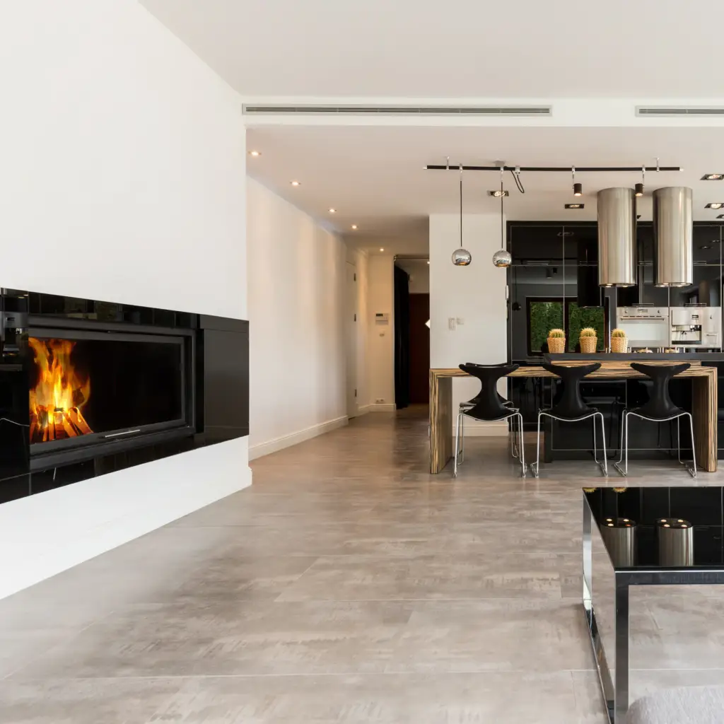 Kitchen with flooring and fireplace.